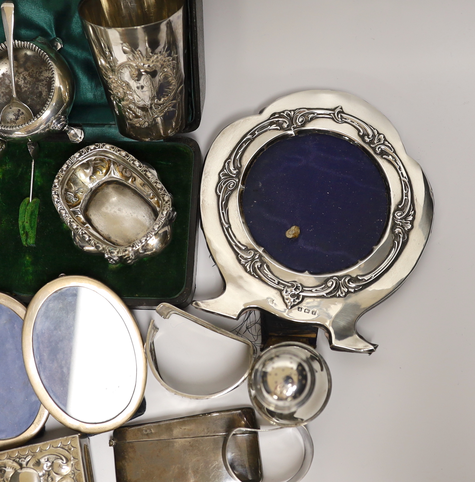 Sundry small silver and white metal items including Edwardian Christening mug, four mounted photograph frames, napkin rings, card cases, bun pepperette etc.